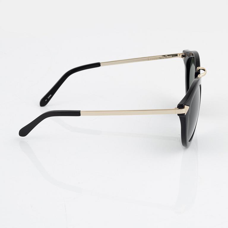 Karen Walker, a pair of "Harvest" sunglasses.