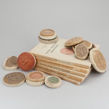 A collection of 12 plaster casts of medieval seals cast by Georg Fleetwood 1930/40s.
