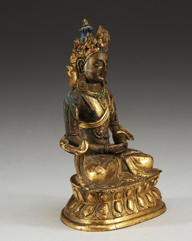 A partial-gilt bronze figure of Avalokiteshvara, Sino-Tibetan, 18th Century.