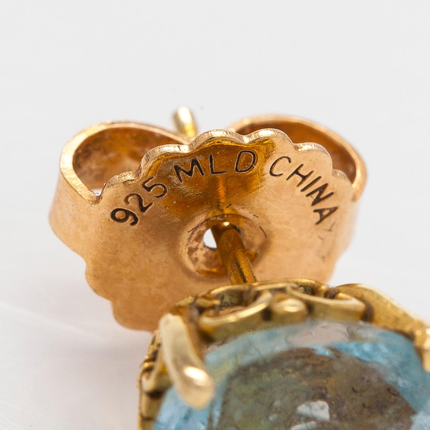 Korvakorut, 18K kultaa, topaasi ja akvamariini.