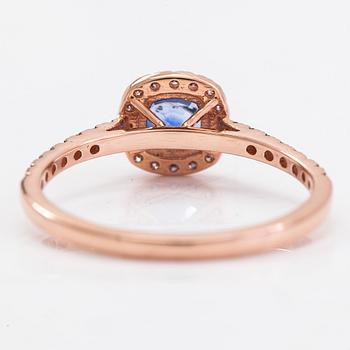 A 14K rosegold ring with a sapphire and diamonds ca 0.12 ct in total.