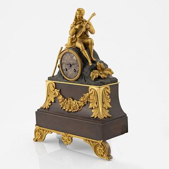 An ormolu and patinated bronze mantel clock, mid 19th Century.