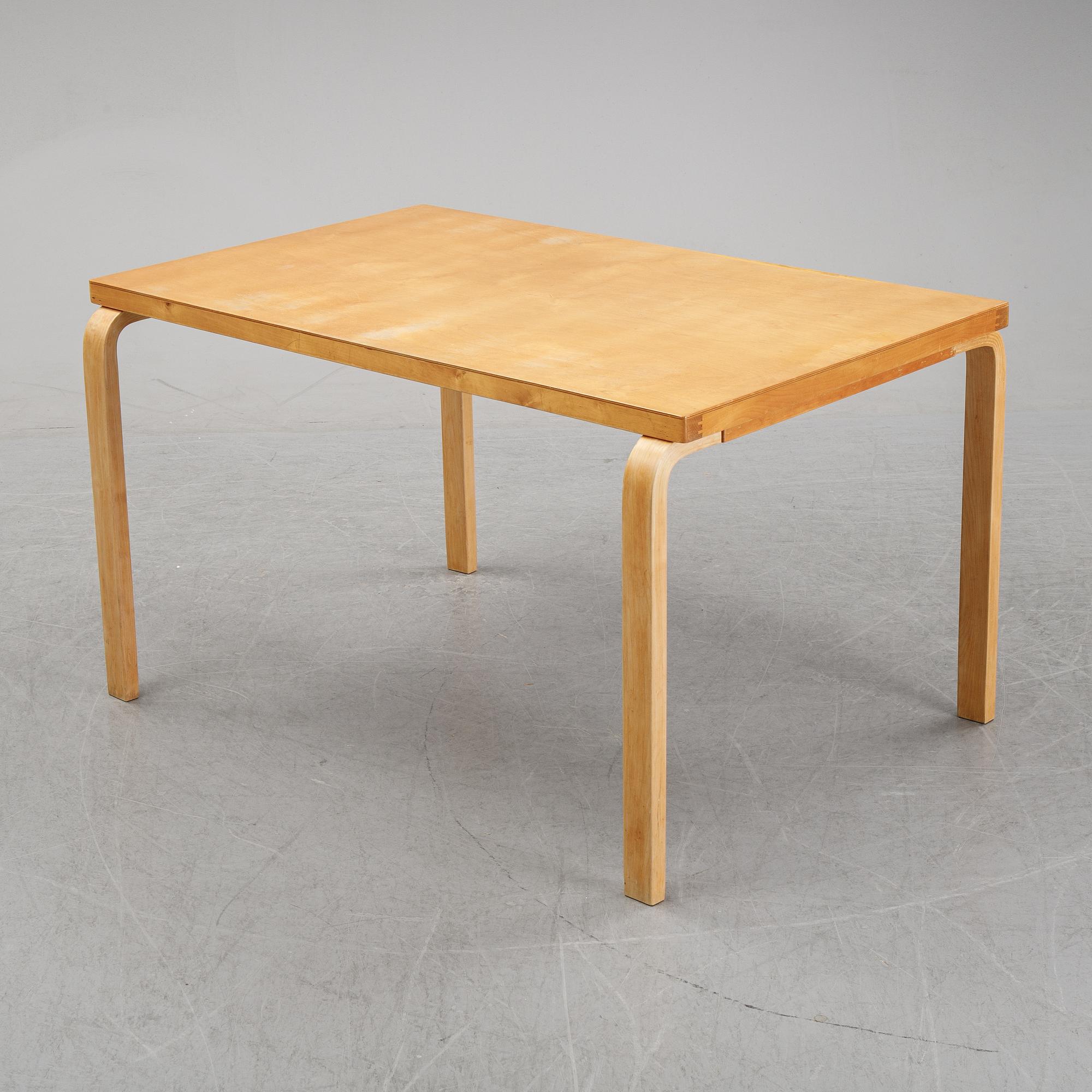 Alvar Aalto, a birch dining table, Artek, Finland, mid 20th Century.
