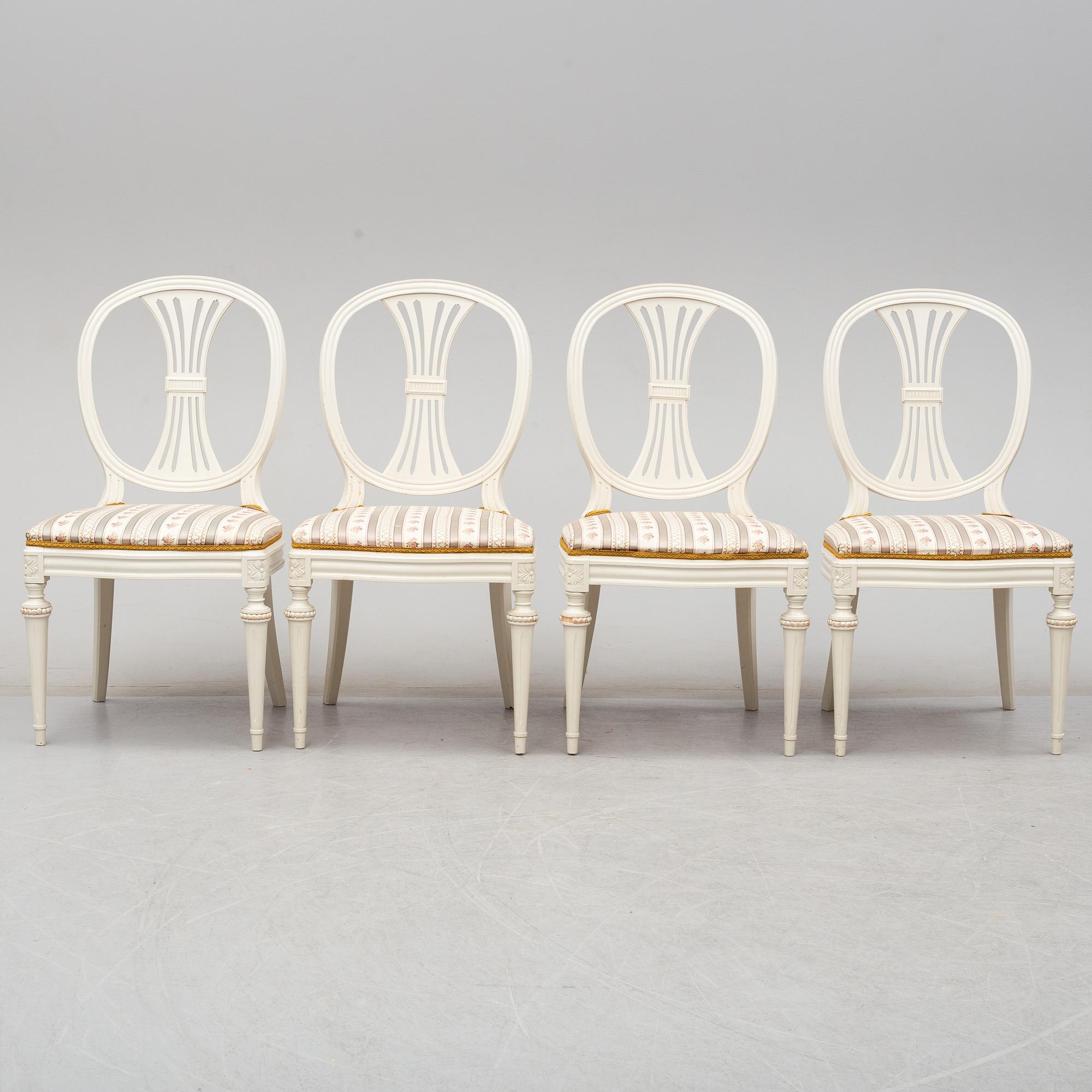 Four chairs with dinner table, late 20th Century.