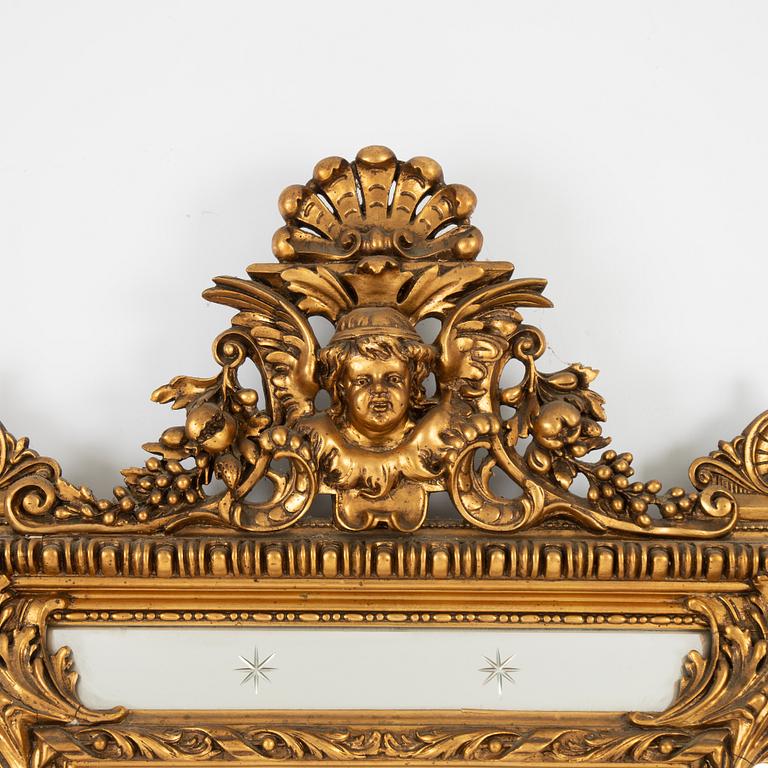 A Baroque style mirror, circa 1900.