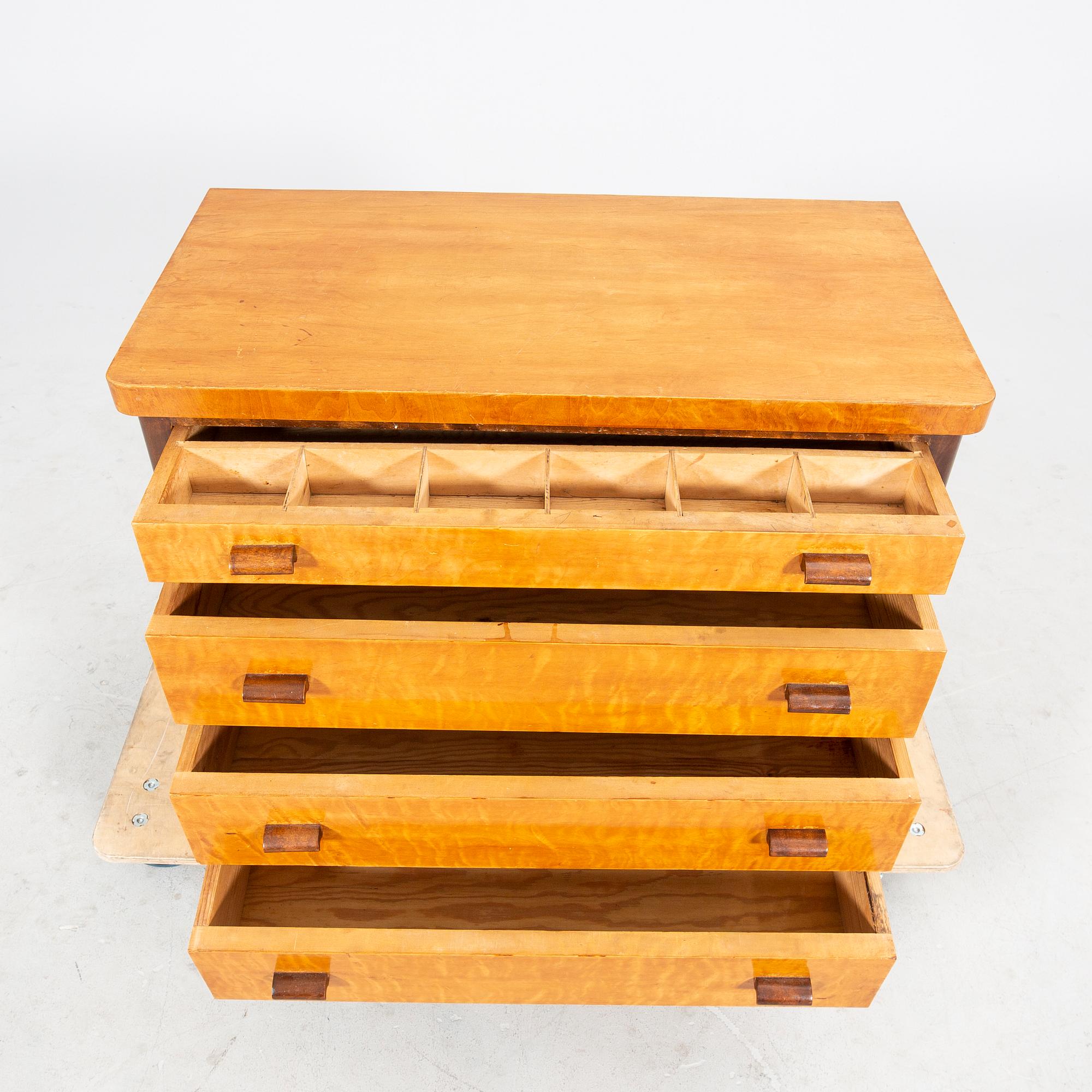 A 1940s Art Deco birch dresser.