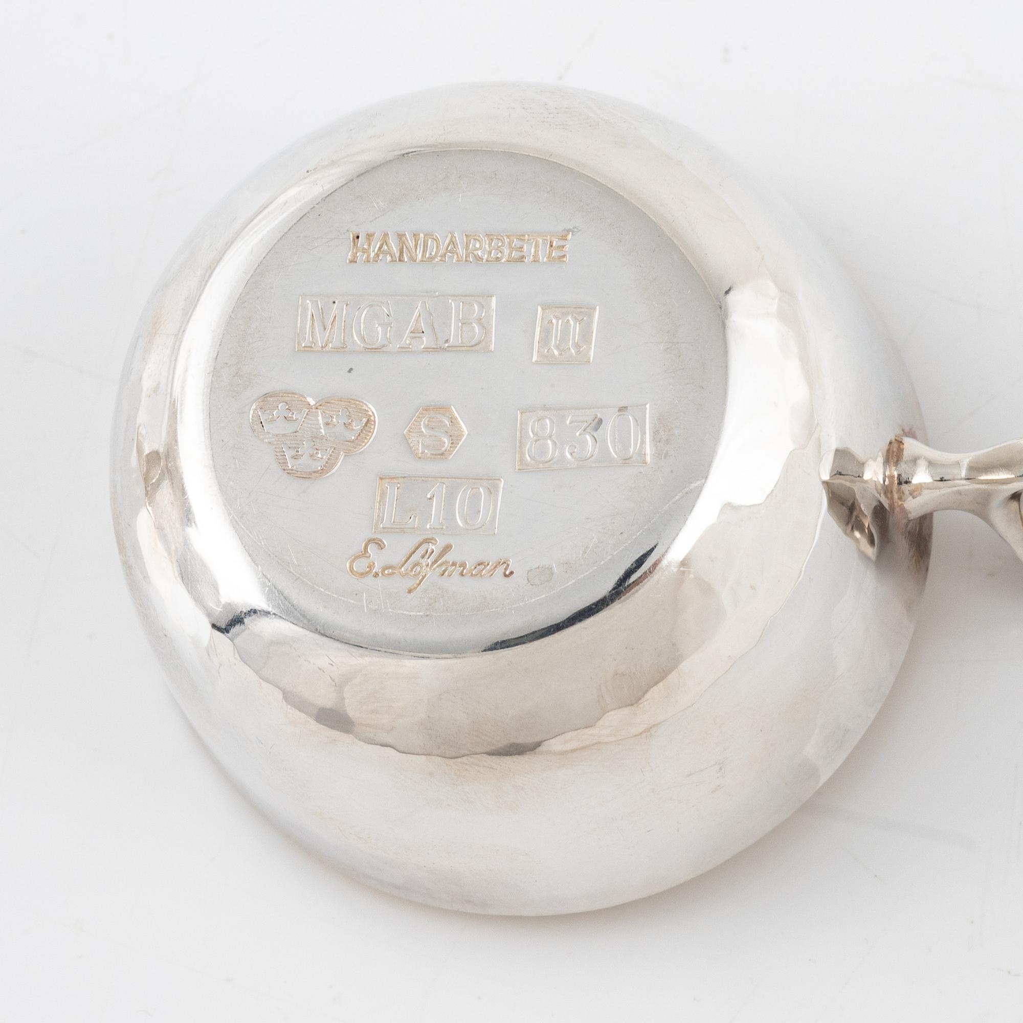 Punschmuggar, 7 st samt bägare, 10 st, silver, bl.a. Eric Löfman, MGAB, Uppsala, 1979.