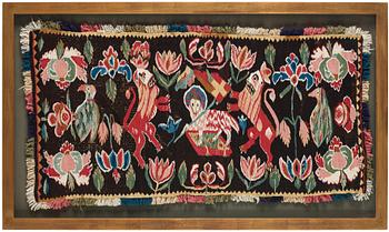 A CARRIAGE CUSHION, tapestry weave, ca 48-51,5 x 98-99 cm as well as fringes, Scania, Sweden, late 18th century.