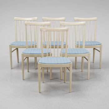 A dining table with six chairs by Carl Malmsten, second half of the 20th Century.