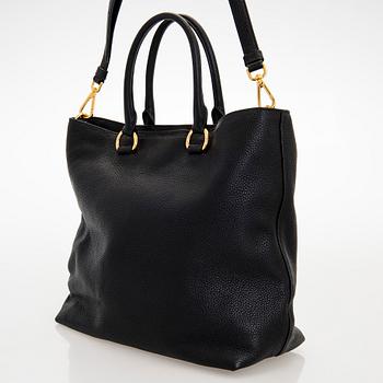 Prada, A 'Vitello Daino Tote' bag.