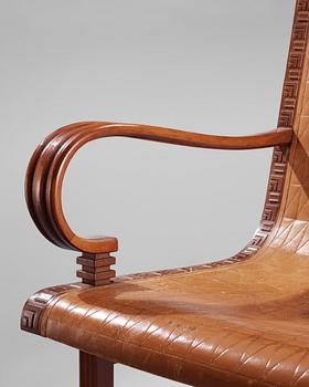 A Hjalmar Jackson pear wood and brown leather easy chair, Stockholm 1934,