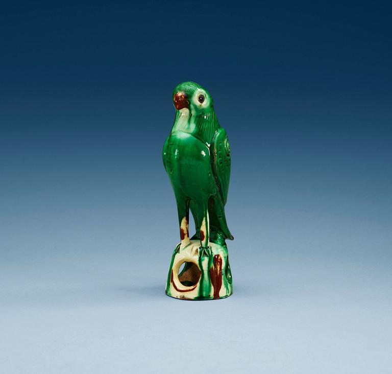 A green glazed figure of a falcon, Qing dynasty.