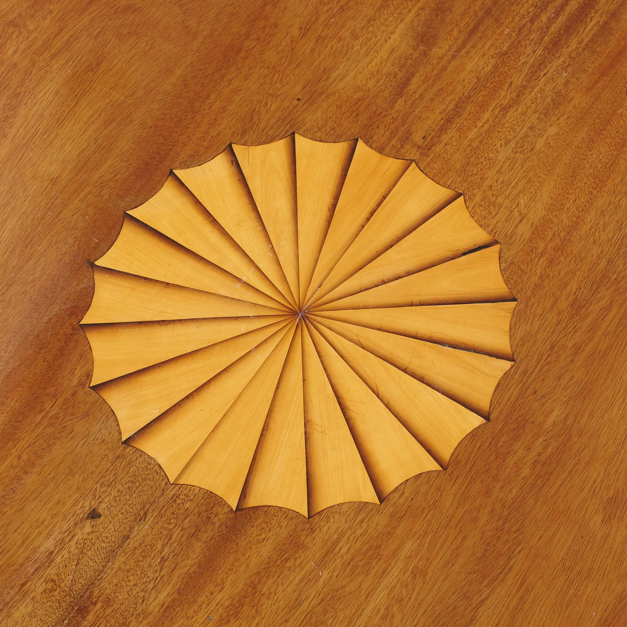 A mahogany veneered Empire style table, first half the 20th Century.