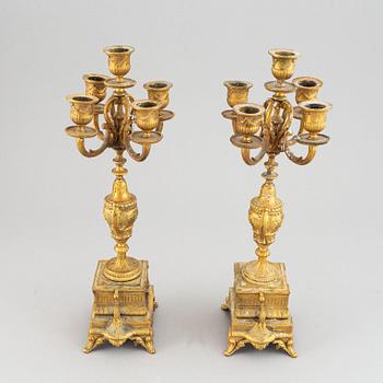 A late 19th century table clock and candelabra, probably France.