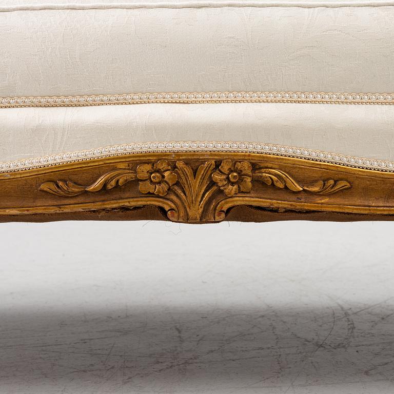 A Louis XV-style sofa, early 20th century.