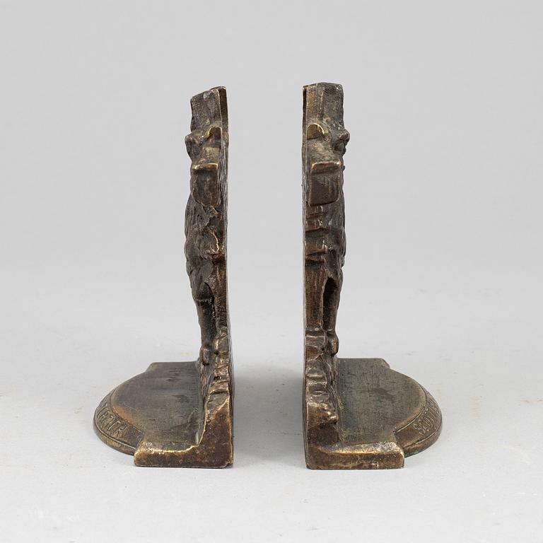 A pair of bronze 20th century book ends.