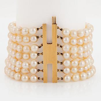 1099. A seven strand cultured pearl Mikimoto bracelet.