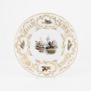 A set of five Meissen porcelain games plates, late 19th to early 20th century.