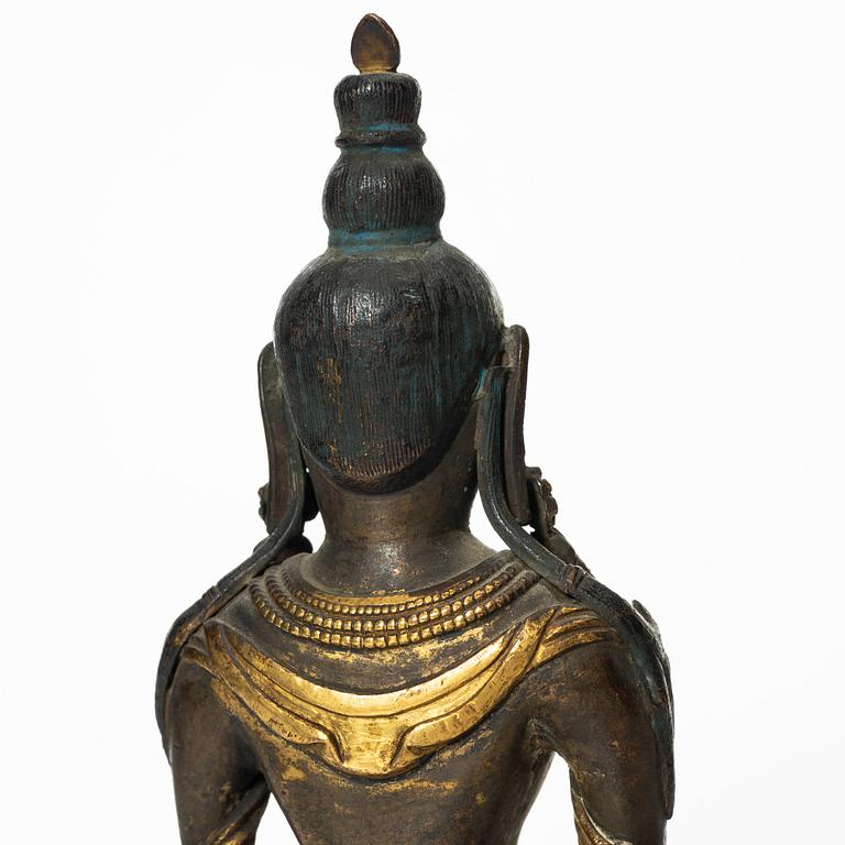 A gilt copper figure of Amitayus, Tibeto-Chinese, 18th Century.