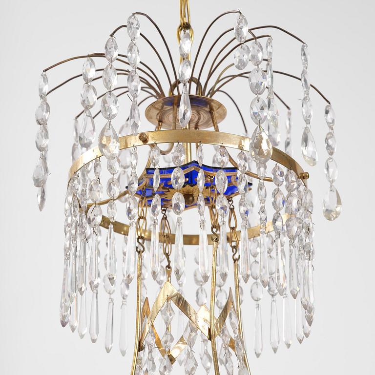 A late-Gustavian five-light gilt brass and cut glass chandelier, Stockholm, late 18th century.