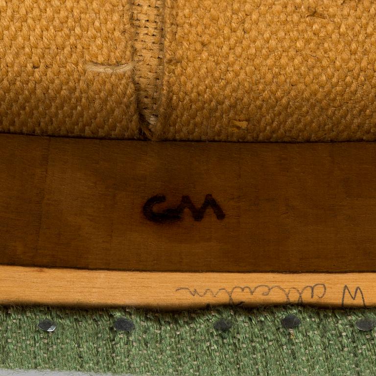 A "Lata Greven" armchair by Carl Malmsten.