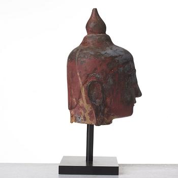 A wooden scultpure of Buddhas head, Thailand/Burma, 20th Century.