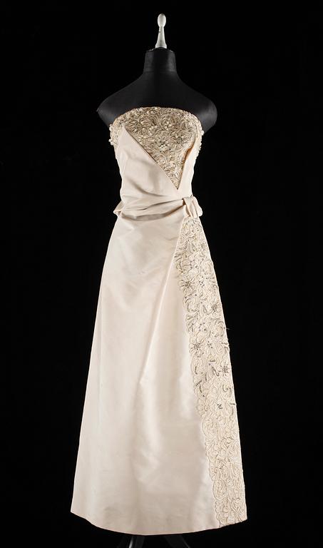 A 1960s white silk evening dress by Leja.