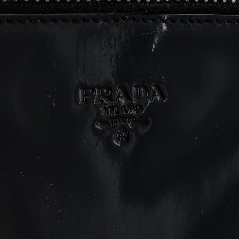 Prada, a patent leather bag.
