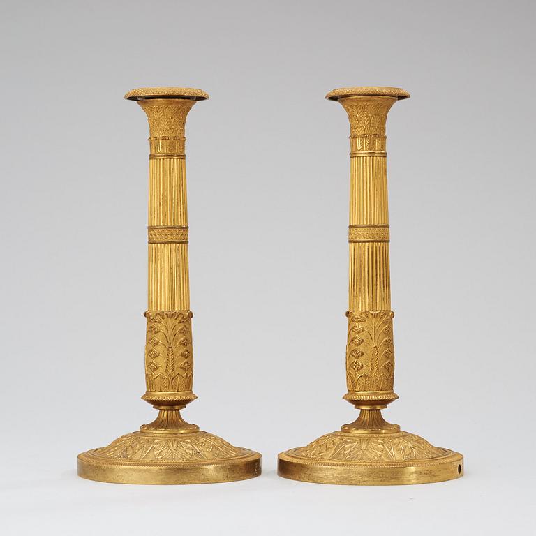 A pair of French Empire early 19th century candlesticks.