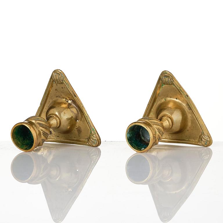 A pair of rococo brass candlesticks by Petter Hemming (master in Stockholm 1771-1807), 1772.