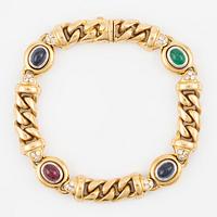 Bracelet, 18K gold curb link with cabochon-cut sapphires, ruby and emerald, as well as brilliant-cut diamonds.