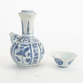 A blue and white kendi and cup, Ming Dynasty.