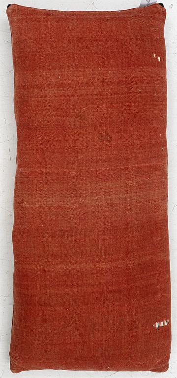 A carriage cushion, knotted pile in relief, ca 106 x 47, southwest of Scania, Sweden, circa 1800.