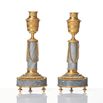 A pair of Louis XVI ormolu and marble cassolettes, late 18th century.