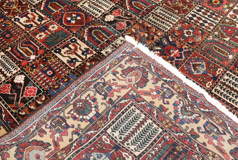 A semi-antique Baktiari carpet, approx. 360 x 308 cm.