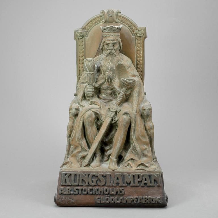 BUTIKSSKYLTNING, skulptur, patinerad gips, 1900-talets början.