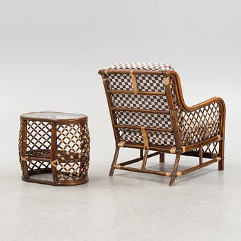 A rattan armchair and table, end of the 20th Century.