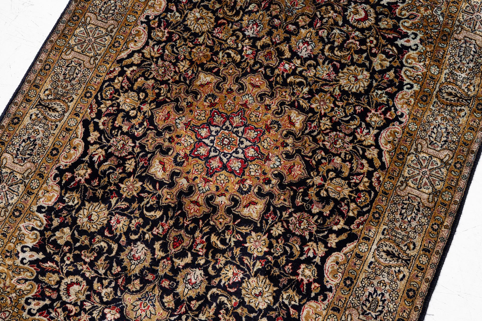 A Ghom, silk rug, c. 162 x 102 cm.