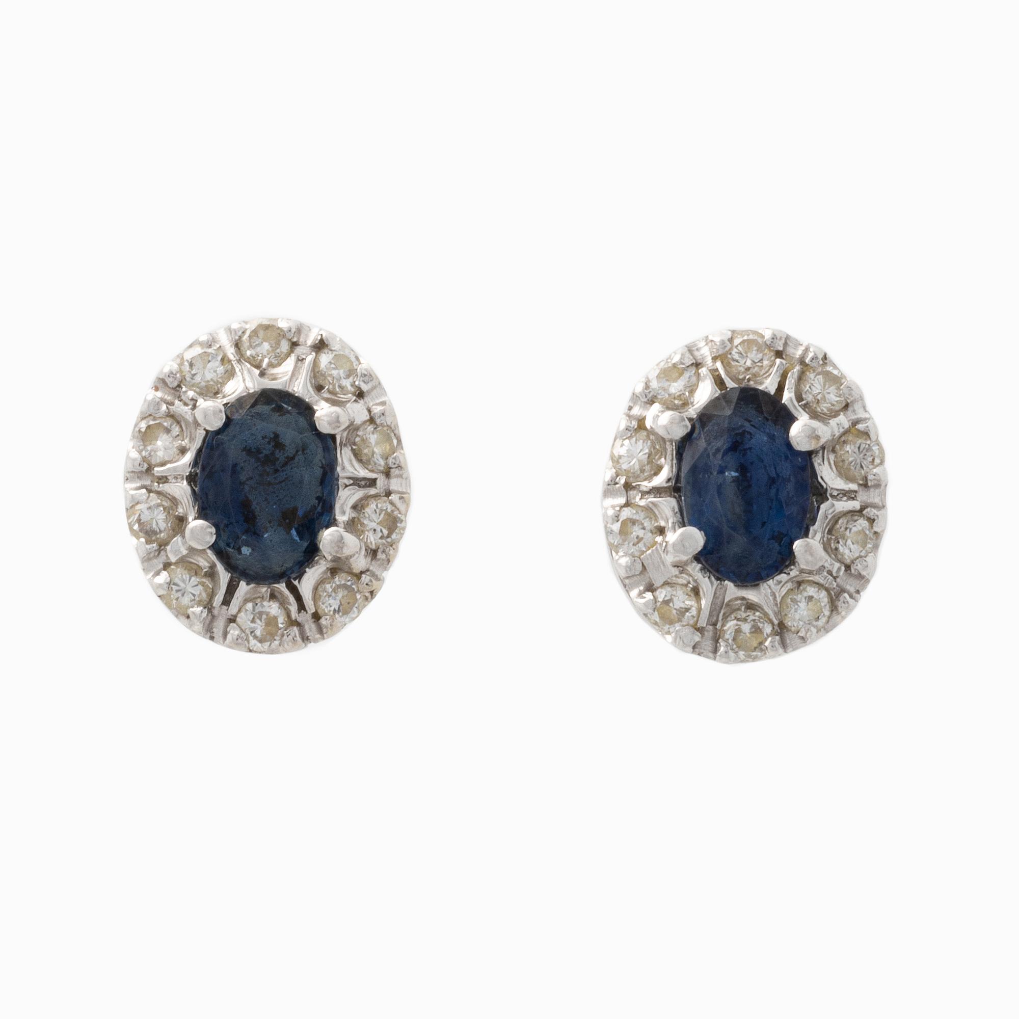 Pendant and a pair of earrings, white gold with sapphires and brilliant-cut diamonds.