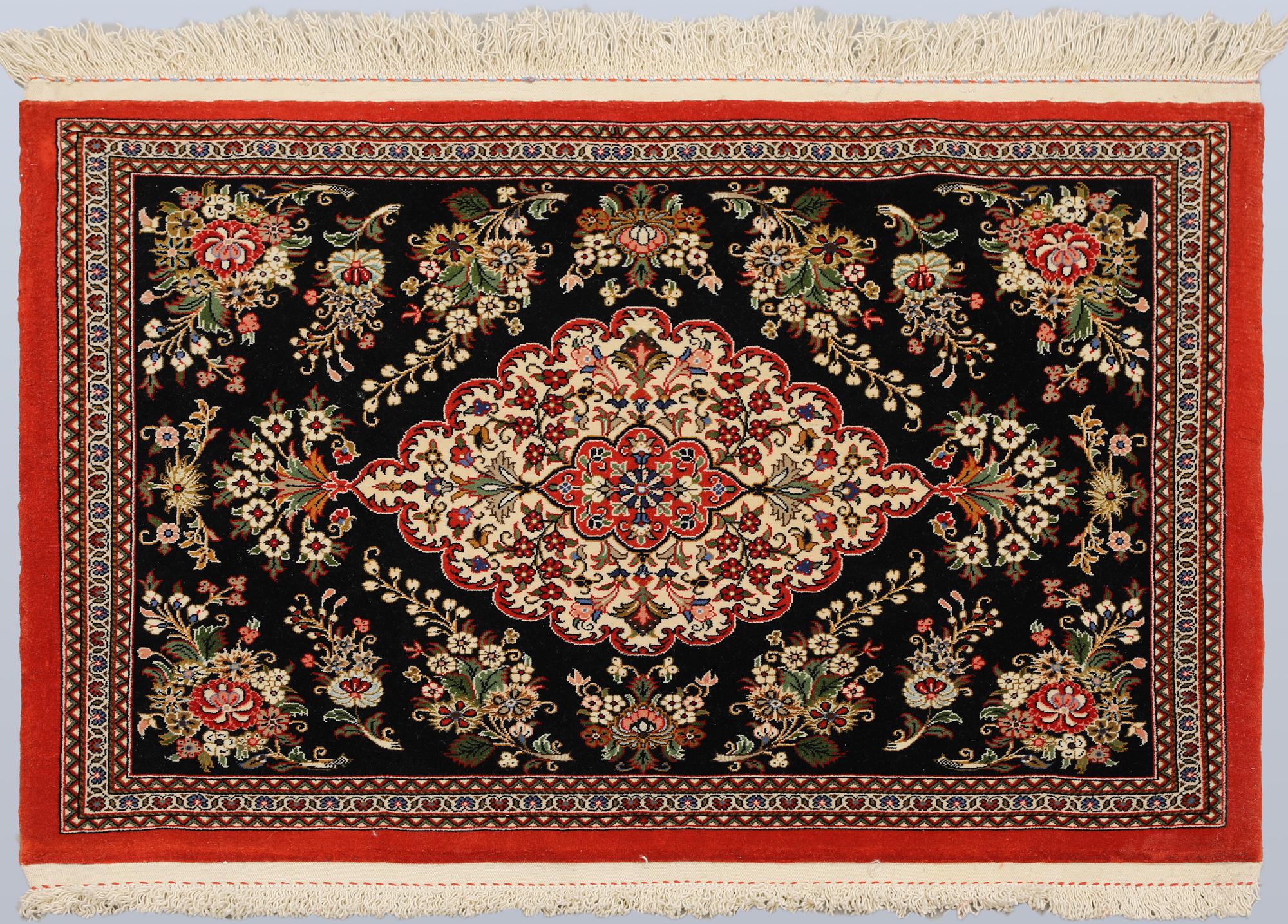 A pair of Tabriz rugs, part silk, so-called 50 Raj, 92 x 62 cm.