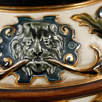 A majolica urn with pedestal from Rörstrand, around the year 1900.