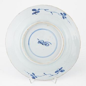 Three blue and white porcelain plates, Kangxi and Qianlong, 18th century.