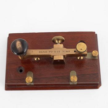 A telegraph from LM Ericsson, and a telegraph key from Digney Frères, early 20th century.