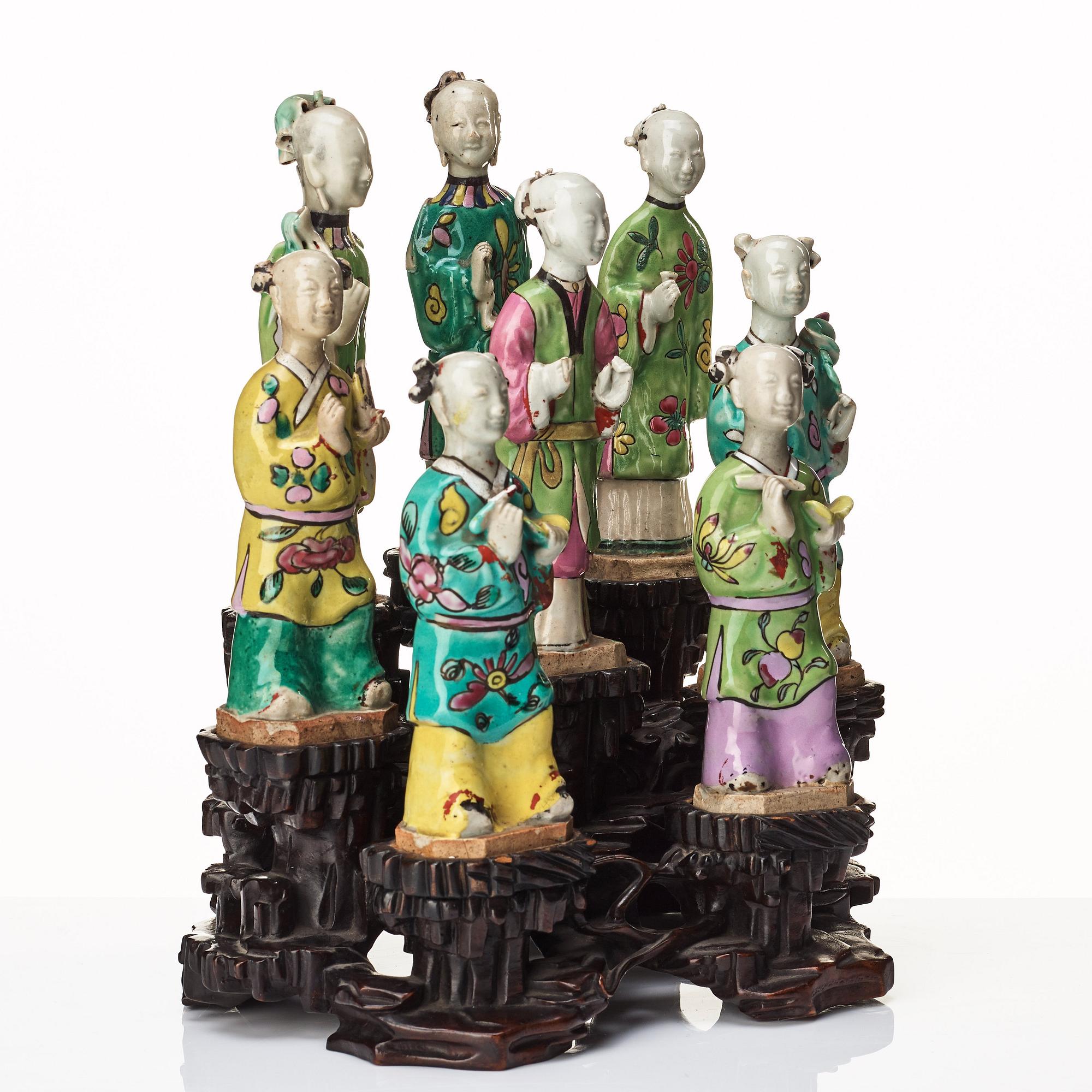 A group of eight immortals on  wooden stand, Qing dynasty, 19th Century.