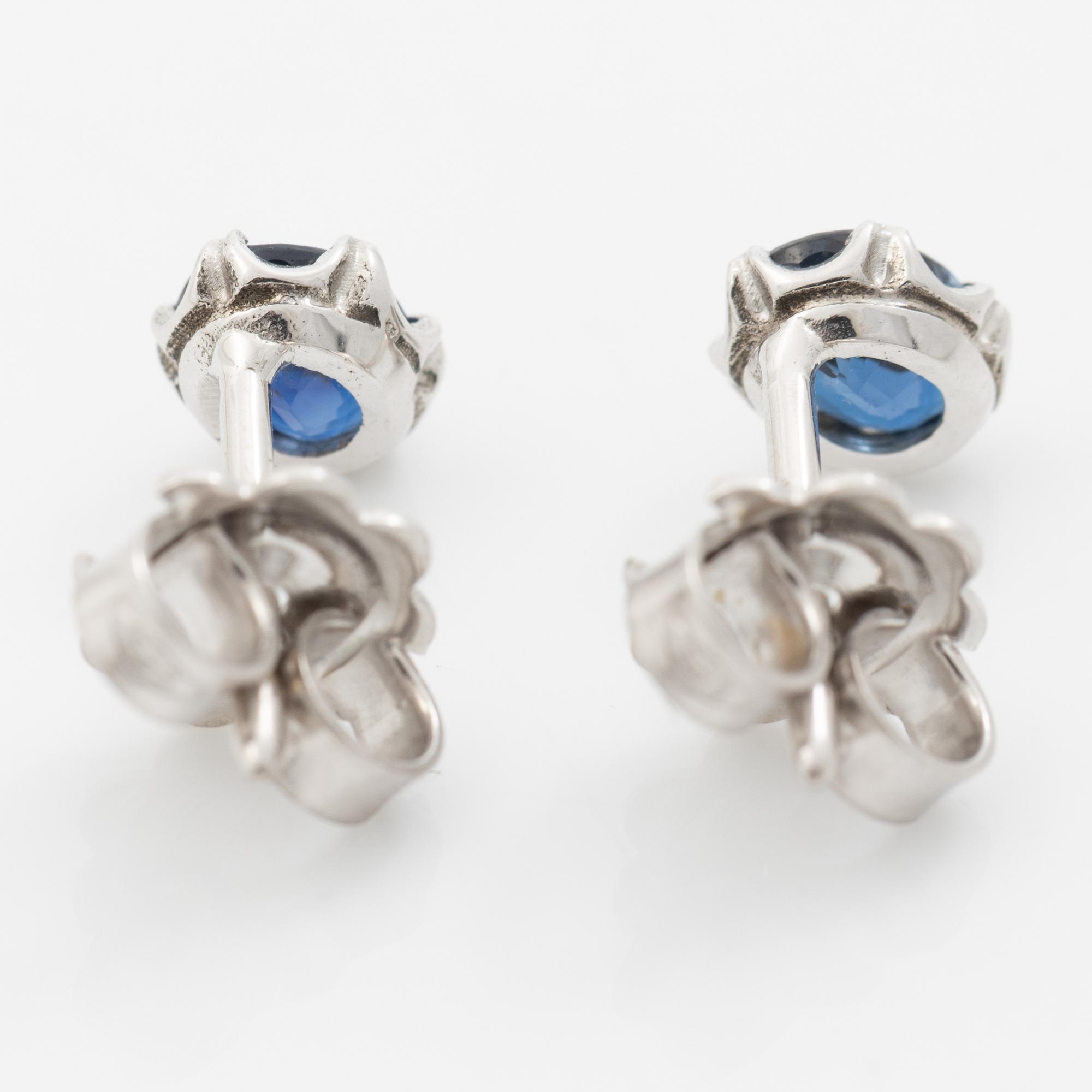 14K white gold earrings with faceted sapphires.
