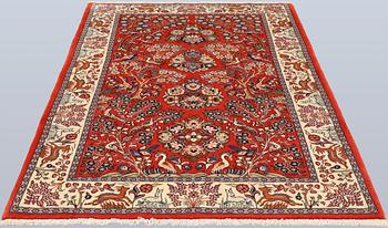 A Sarouk rug, approx. 212 x 140 cm.