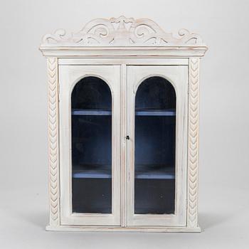 A late 19th-century wooden wall cabinet.