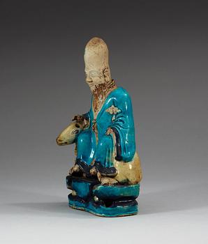 A turquoise-glazed porcelain figure of Shoulao, 17th Century.