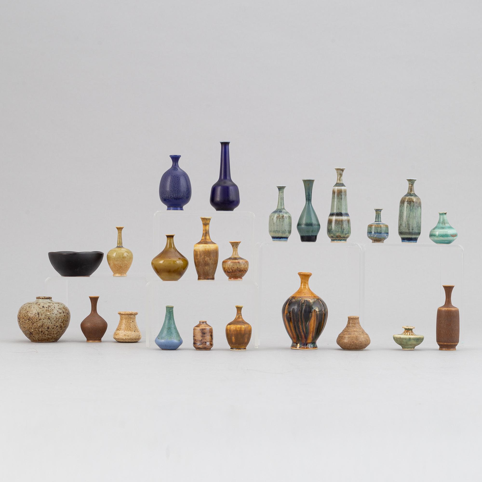 A set of 21 stoneware miniature vases and a bowl, including Höganäs.