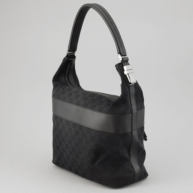 GUCCI, a canvas and leather bag.